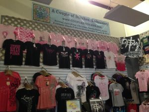 Pink, white, and black custom t-shirt store display