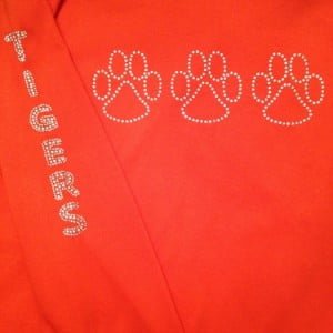 A close up of the back of an orange shirt