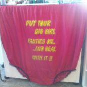 A red curtain with words on it