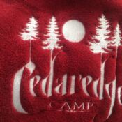A close up of the logo for cedarridge camp