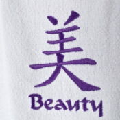 A purple and white towel with the word beauty written in chinese.