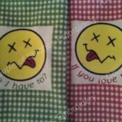 Two pillows with a smiley face on them
