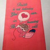 A red towel with an image of a girl holding a balloon.