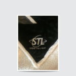 A close up of the logo on a blanket