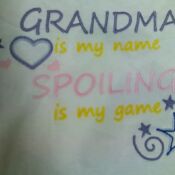 A close up of the words grandma is my name, spoiling is my game.