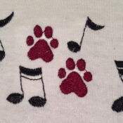 A close up of the paw prints and notes on the towel