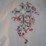 A cross with red and black designs on it.