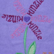 A purple flower with the word " millie " written in it.