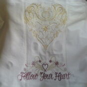 A white pillow with the words " follow your heart ".