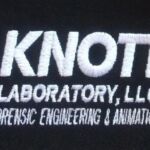 A black shirt with the words " knott laboratory, llc forensic engineering & animation."