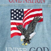 A denim jacket with an eagle and american flag on it.
