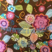 A close up of the fabric with colorful flowers