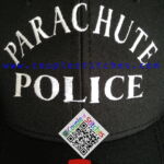 Black cap embroidered with "PARACHUTE POLICE" text