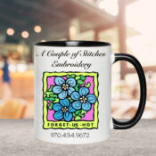 White mug with colorful forget-me-not logo