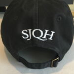 Black baseball cap with white SQJH embroidery