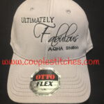 White embroidered cap saying Ultimately Fabulous