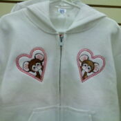 White children's hoodie with heart teddy patches