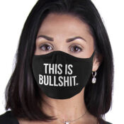 Person wearing black mask reading "This is bullshit.