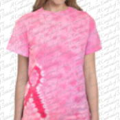 A woman wearing pink tie dye shirt with breast cancer ribbon.