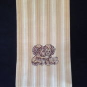 Beige striped cloth with embroidered teddy bears