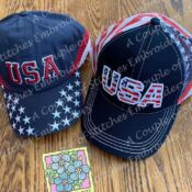 A couple of hats sitting on top of a wooden table.
