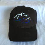 Black cap with blue wolf mountain embroidery