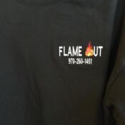 Black shirt with Flame Out logo and number