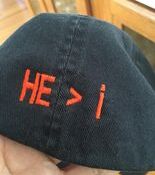 Black kippah embroidered "HE > i