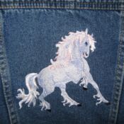 Embroidered prancing horse on denim jacket