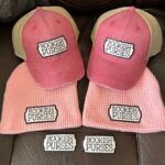 Two pink "Bookish Purses" trucker hats and beanies