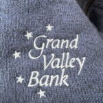 Grand Valley Bank embroidered logo on sweater