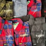 Folded plaid and solid flannel shirts
