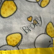 Plush baby blanket with yellow duck print