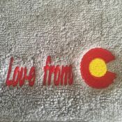 Towel embroidered "Love from" with Colorado emblem
