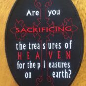 Oval embroidered patch with red cross and text