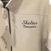 White softshell jacket embroidered Shelter Insurance logo