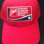 Red cap with veterans employee resource patch