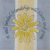 A yellow flower with the words " it will comfort friendship will bloom and grow ".