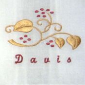 Embroidered gold vine with "Davis" name
