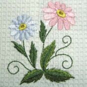 A close up of two flowers on a towel