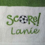 Towel embroidered "Score! Lanie" with soccer ball