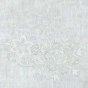 A white cloth with some flowers on it
