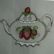 Embroidered teapot with strawberry motif