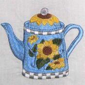 Blue embroidered teapot with sunflowers