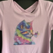 Pink t-shirt featuring rainbow kitten and butterfly
