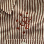 Striped shirt with embroidered monogram and stars