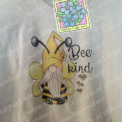 Gnome dressed as bee on beige shirt