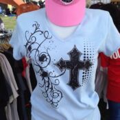 Mannequin wearing light blue V-neck with black cross