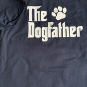 Blue T-shirt reading "The Dogfather" with paw