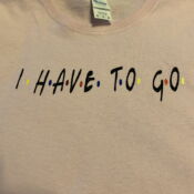 Pink sweatshirt with "I HAVE TO GO" text